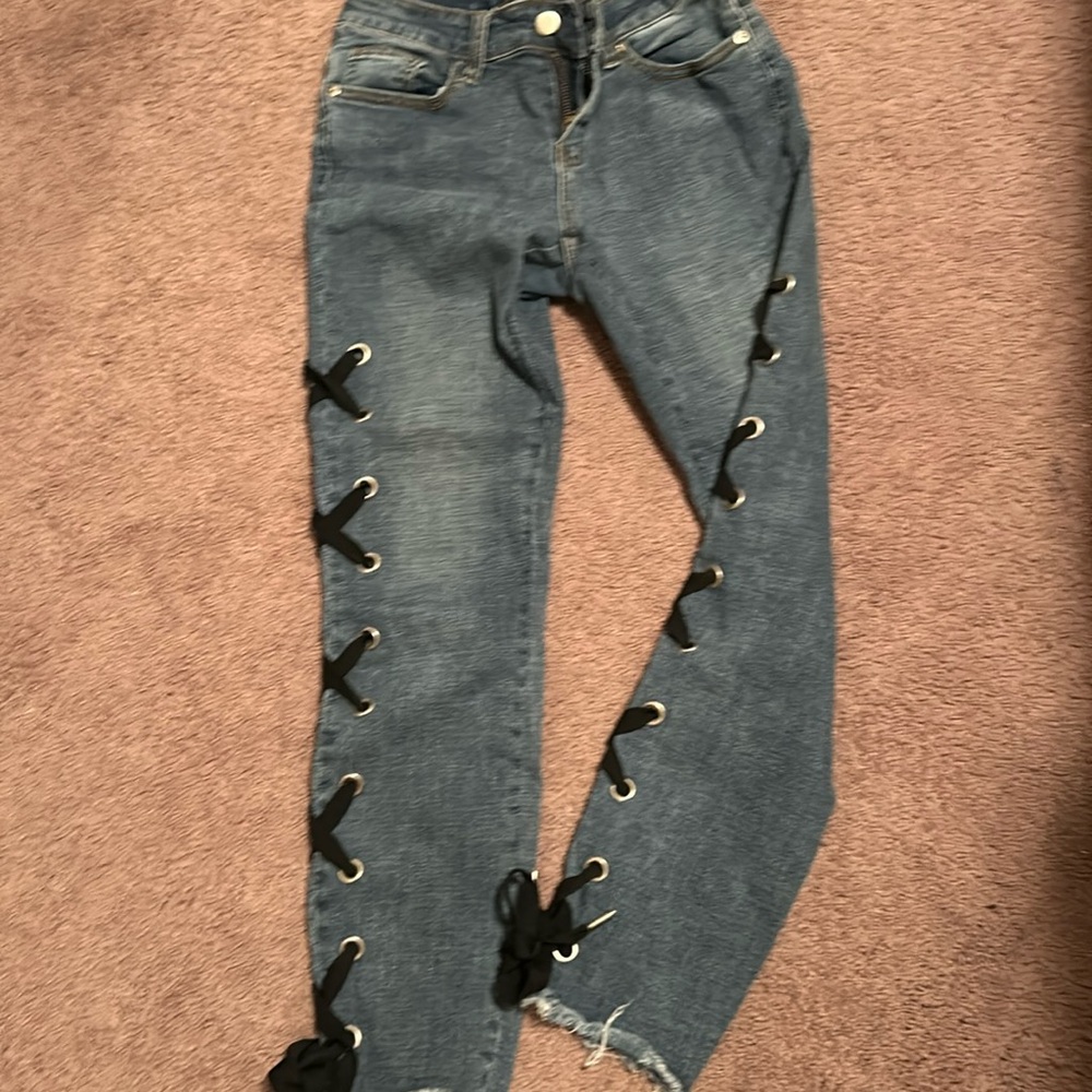 Blue jeans with ties.